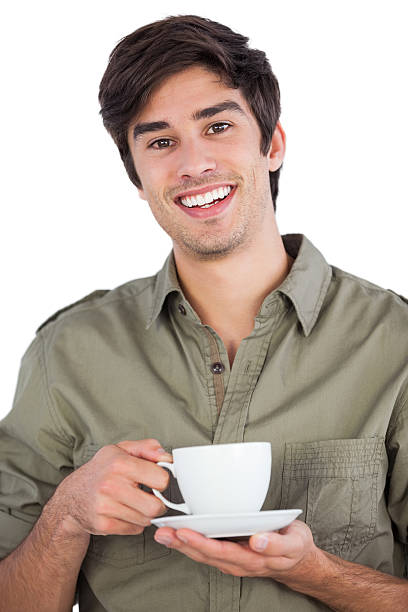 istock Smiling man holding cup of coffee 485895703