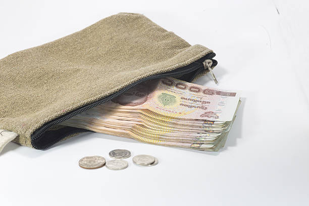 istock Brown fabric bag with Thai banknote and coins 485895746