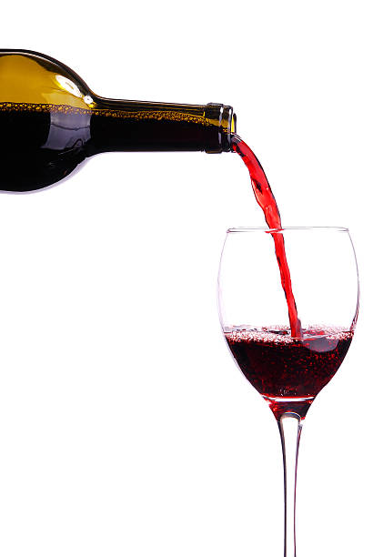 istock Pouring red wine into a glass 485896408