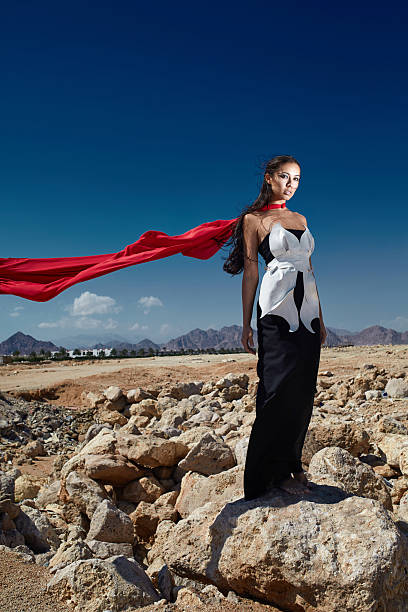 istock girl on stones 485897309