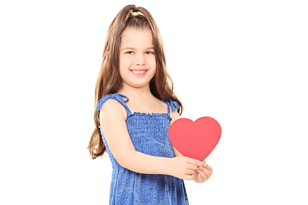istock Little girl holding a red heart 485898423