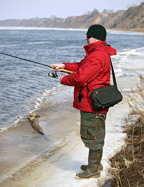 istock Man fishes in the early spring 485899659
