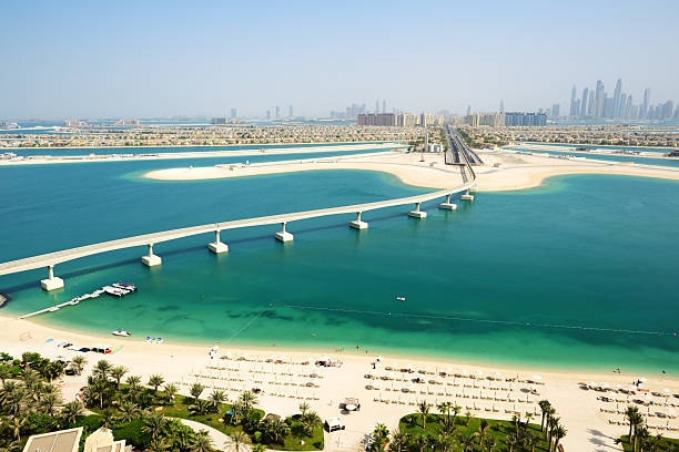 View on Jumeirah Palm man-made island, Dubai, UAE View on Jumeirah Palm man-made island, Dubai, UAE atlantis the palm stock pictures, royalty-free photos & images