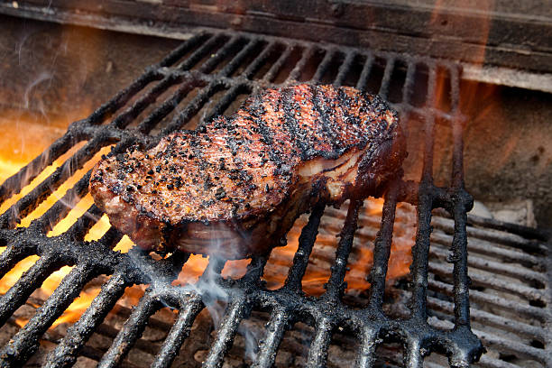 New York Steak on Grill with Fire