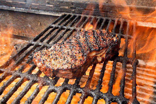 New York Steak on Grill with Fire