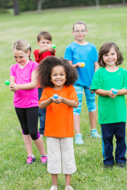 istock Multiracial group of children in an egg spoon race 485904922