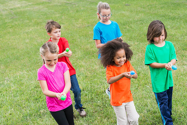 istock Group of children in egg spoon race 485904970