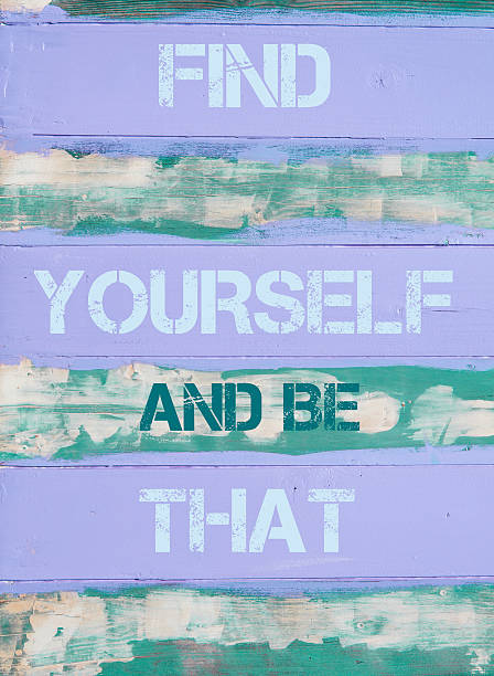 Concept image of FIND YOURSELF AND BE THAT  motivational quote written on vintage painted wooden wall