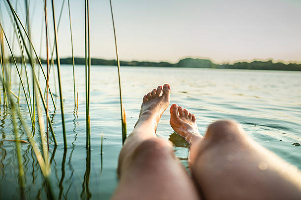 istock Woman´s feet floating in water, European summer 485908222