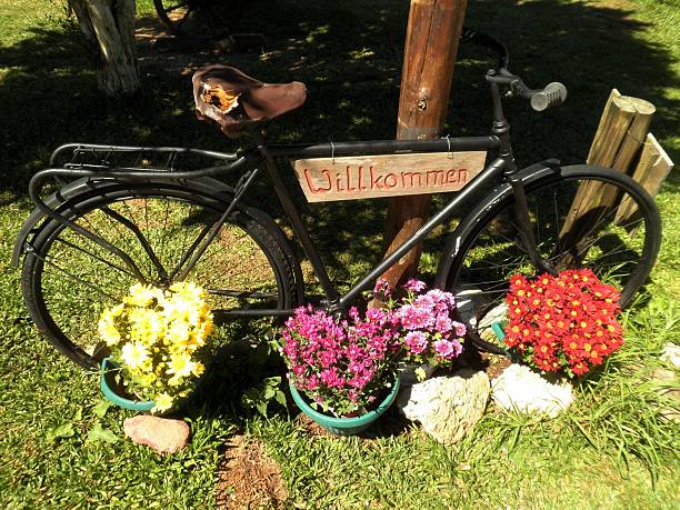Bicycle welcome sign flowers nature in Germany.