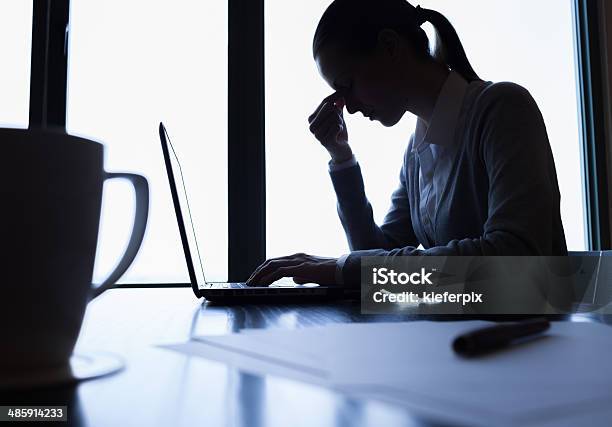 Stressed Business Woman Stock Photo - Download Image Now - Desk, In Silhouette, One Woman Only