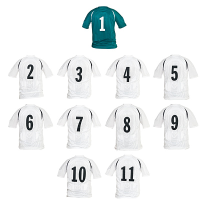 Football shirts formed as a team isolated on white background
