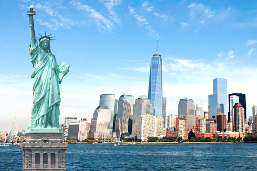 Amazing view of New York City featuring The One World Trade Center, Empire State Building and Statue of Liberty.