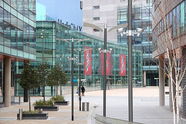 MediaCity UK Manchester, UK - April 22, 2013: People visit MediaCityUK in Manchester, UK. MediaCityUK is a 200-acre development completed in 2011, used by BBC, ITV and other companies. itv photos stock pictures, royalty-free photos & images