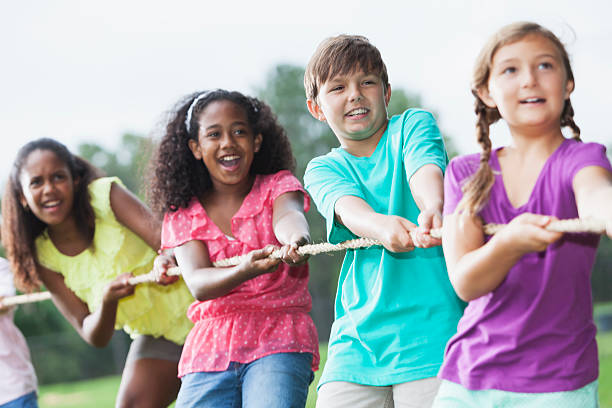 istock Children playing tug of war 485924213