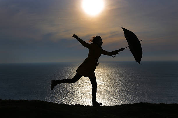 istock Girl with umbrella 485924397