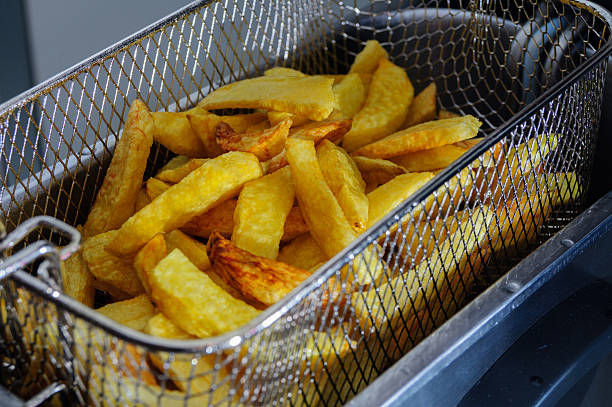 istock Salted chips, freshly cooked in the fryer, fried potatoes, peeled 485925268
