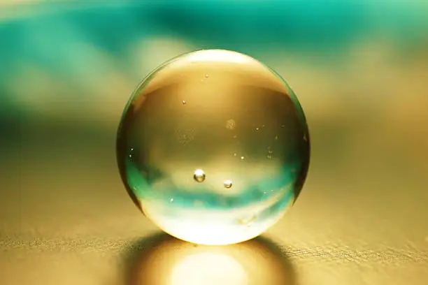 Photo of Artistic composition of aqua glass ball