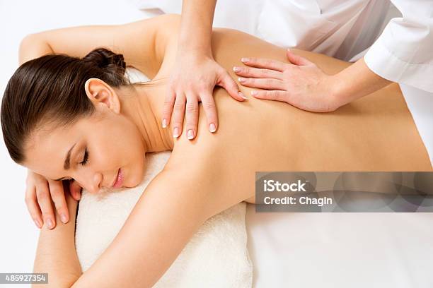 Massage On The Back Of Woman Stock Photo - Download Image Now - 2015, Adult, Adults Only