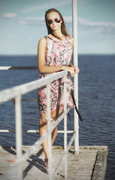 istock Young girl at pier (ancient ver) 485934110