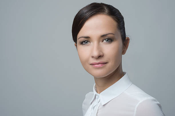 istock Charming smiling woman in white shirt 485935956
