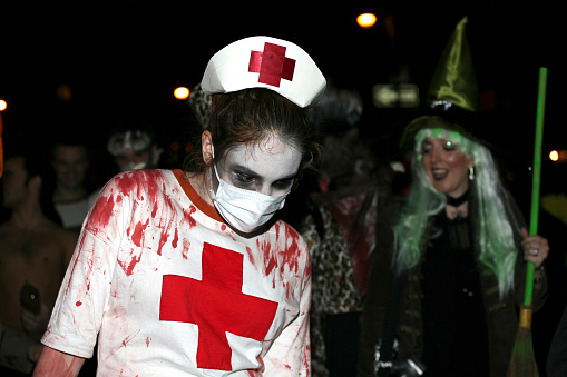 New York, NY, USA - October 31, 2008: Woman dressed as bloody nurse attends the annual Halloween parade in Greenwich Village.