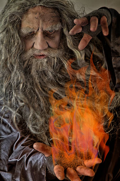 istock Mature male holding flames 485936632