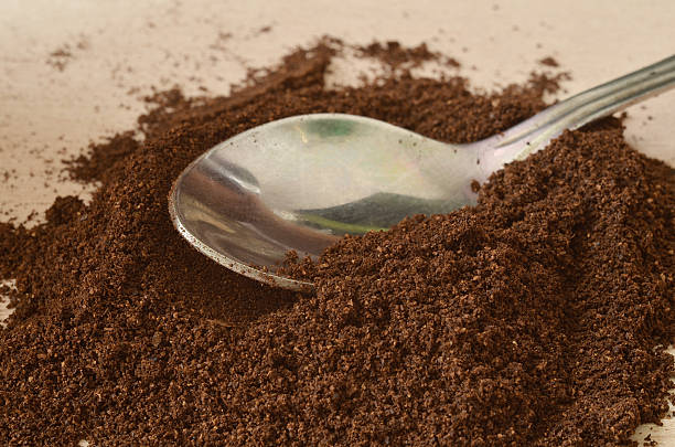 istock Spoon in light dark powder of coffee 485941864