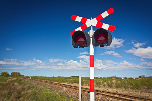 Railroad crossing with lights and railroad track