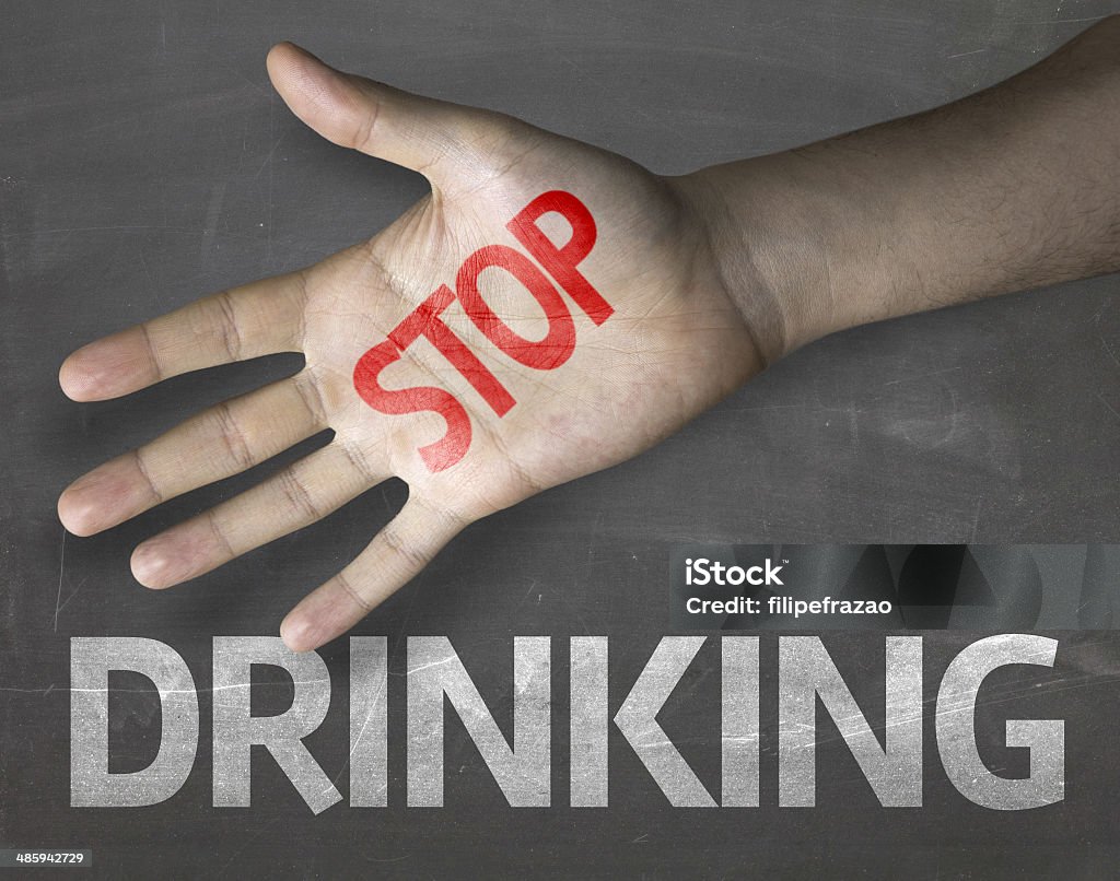 Educational and Creative composition with the message Stop Drinking Educational and Creative composition with the message Stop Drinking on the blackboard Drunk Stock Photo