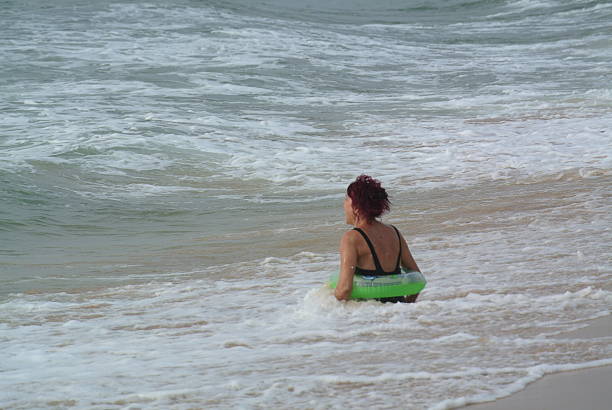 Lady in Wave stock photo