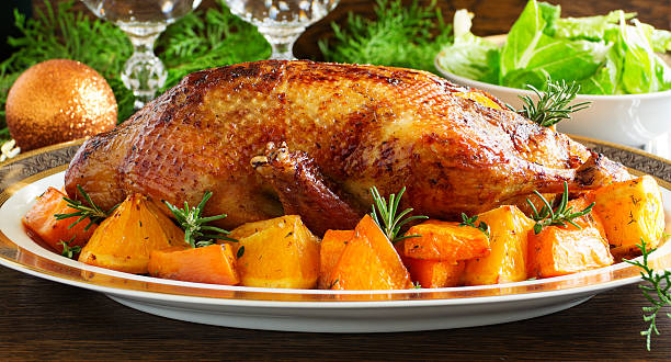 istock Roast duck with pumpkin and oranges. 485944212