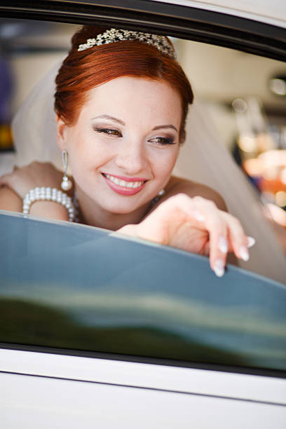 istock Lovely red hair bride posing with flowers outside. 485945207