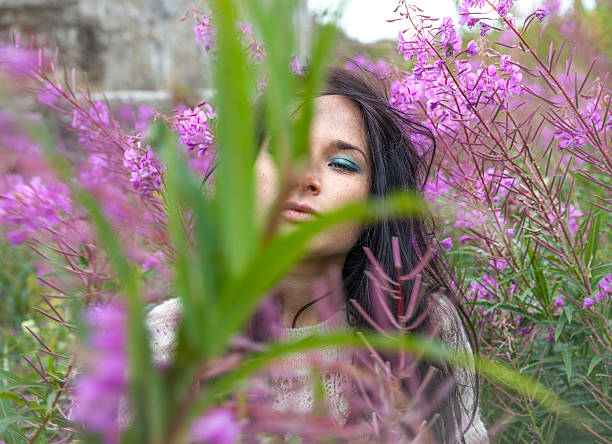 istock beautiful girl among the flowers 485945921