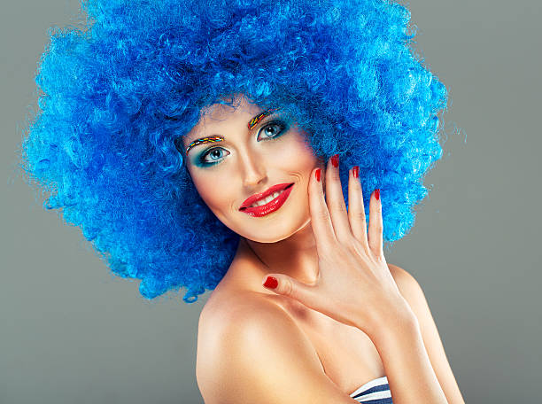 istock beautiful girl with bright makeup, red lips in blue wig 485945957