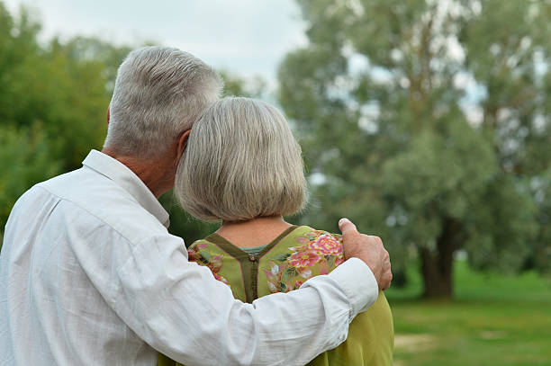 istock Mature couple on  in summer park 485946378