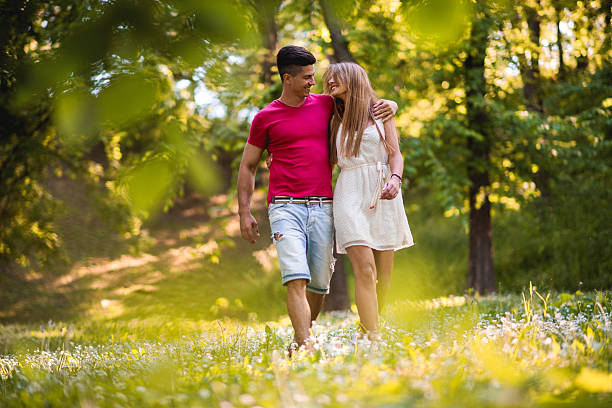 istock Loving couple communicating while walking embraced in nature. 485946430