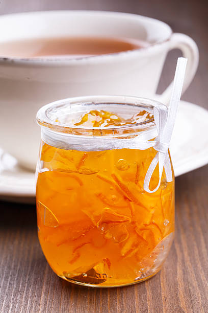istock Orange jam and cup of tea 485947431