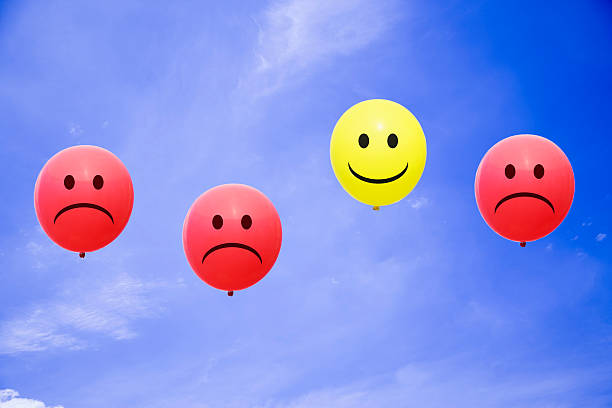 istock Bright balloons flying in the blue sky with a smiley 485948140