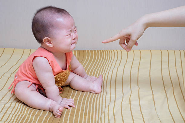 Asian baby crying while mother scolding Asian baby crying while mother scolding asian baby crying while mother scolding stock pictures, royalty-free photos & images
