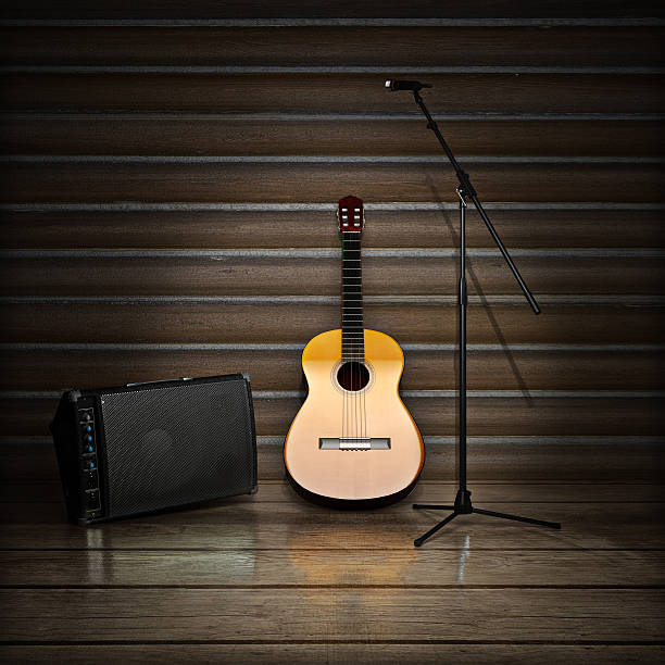 istock Music themed background with acoustic guitar , amp and microphone 485948938
