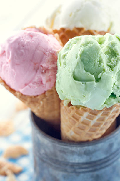 istock Closeup of pink and green ice cream cones 485949621
