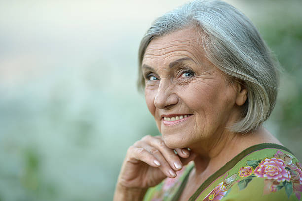 istock Senior woman in summer park 485949640