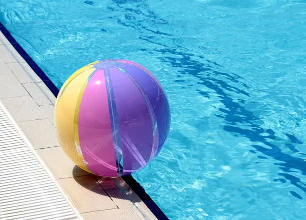 Beachball and swimmingpool. Vacations background