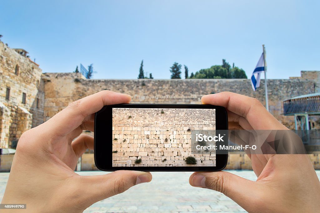 taking photo in western wall of jerusalem tourist man photographing with the smartphone at western wall of jerusalem israel Camera - Photographic Equipment Stock Photo