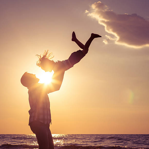 istock Father and son playing on the beach 485952846