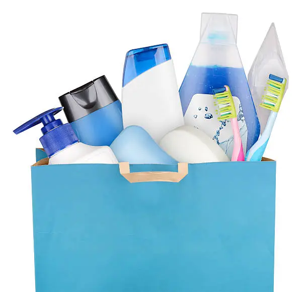Bag with detergents and cosmetics isolated on white background