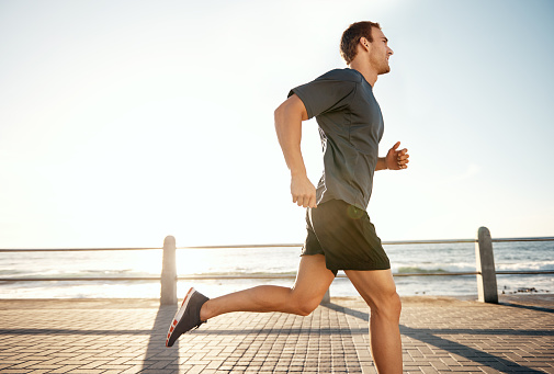 Shot of a man jogging on the promenadehttp://195.154.178.81/DATA/i_collage/pu/shoots/805460.jpg