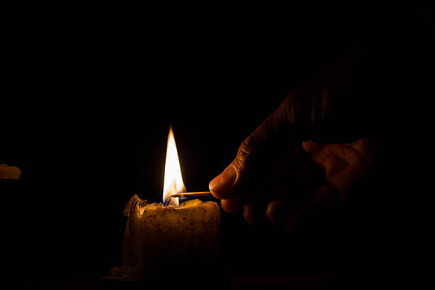 istock Men are using the match to light the candle 485954874