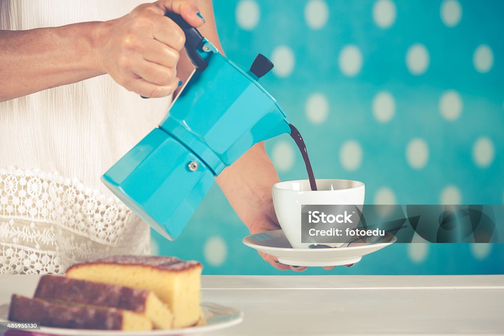 Woman serving coffee Woman serving coffee and vintage style clothing 2015 Stock Photo